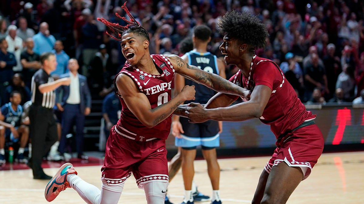 Temple players celebrate after beating Villanova