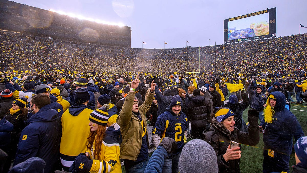 Fans celebrate after Michigan beats Ohio State in 2021