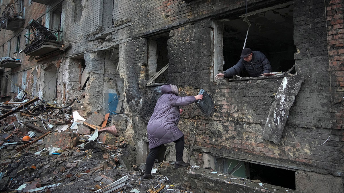 People searching rubble in Kyiv