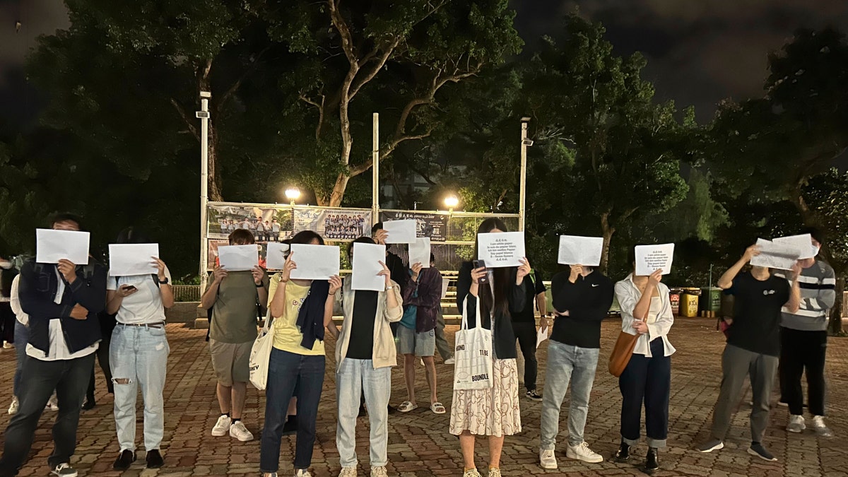 Protesters light candles in China