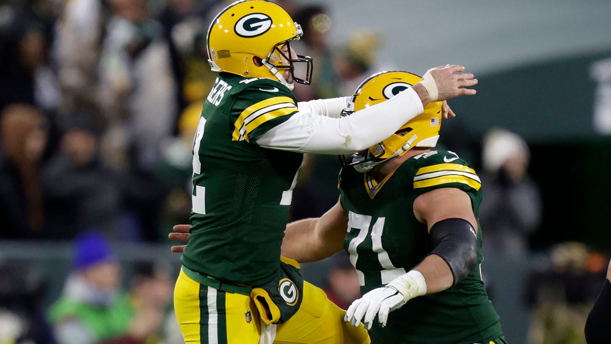 Aaron Rodgers celebrates a score