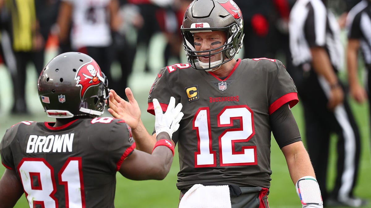 Buccaneers Tom Brady and Antonio Brown celebrate a touchdown against the Atlanta Falcons at Raymond James Stadium in Tampa on Jan. 3, 2021.