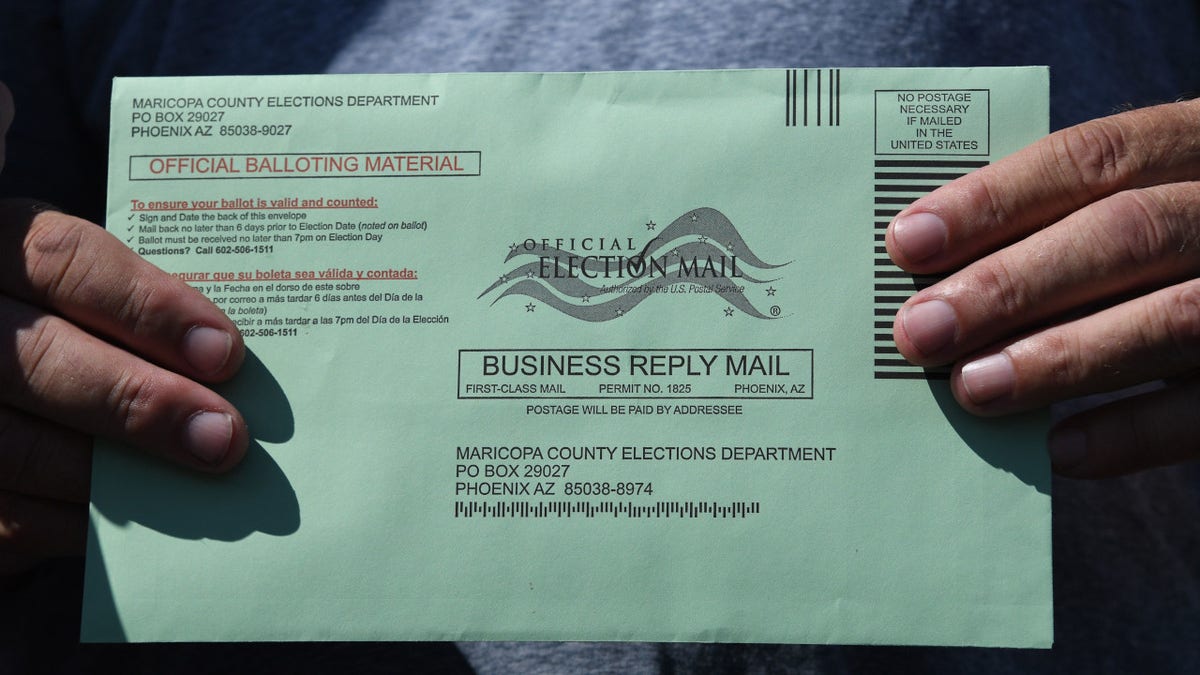 An Arizona voter displays their mail-in ballot for the 2020 election.