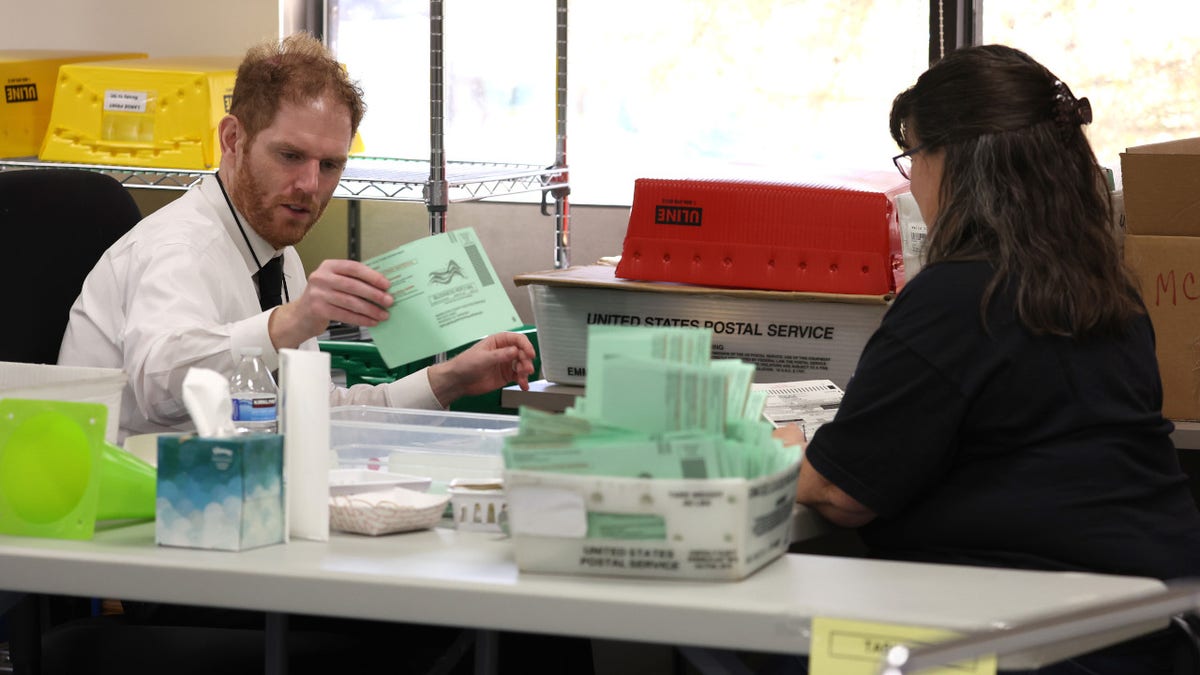 Maricopa County recorder Stephen Richer tabulates ballots