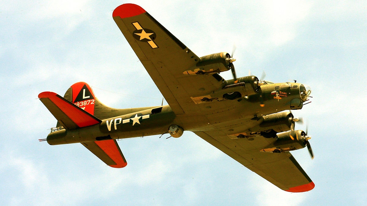 B-17 aircraft named "Texas Raiders" flying