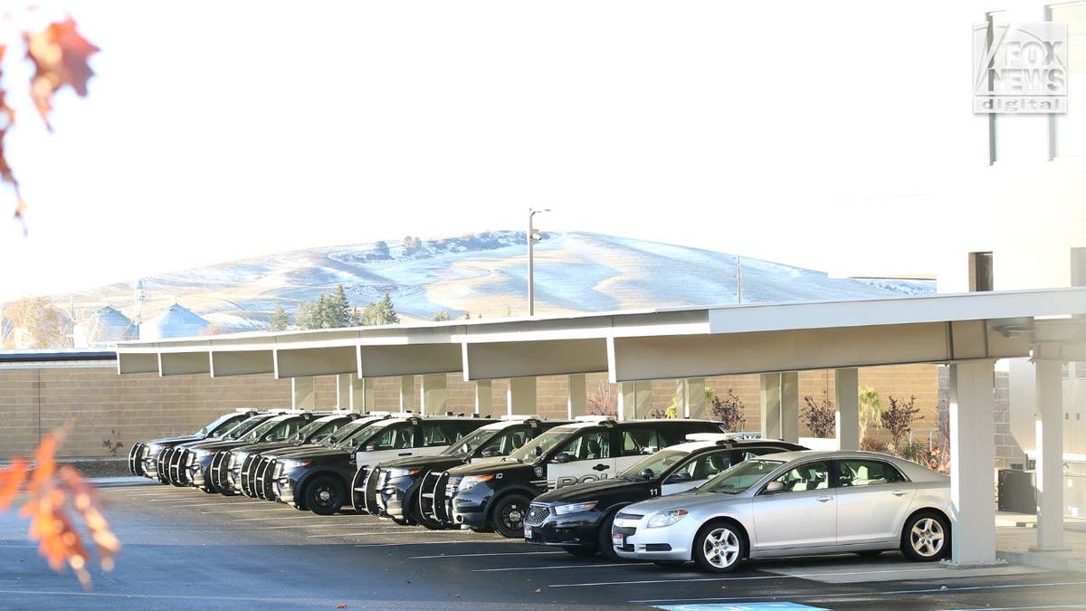 Moscow Idaho police cars in empty parking lot on Thanksgiving