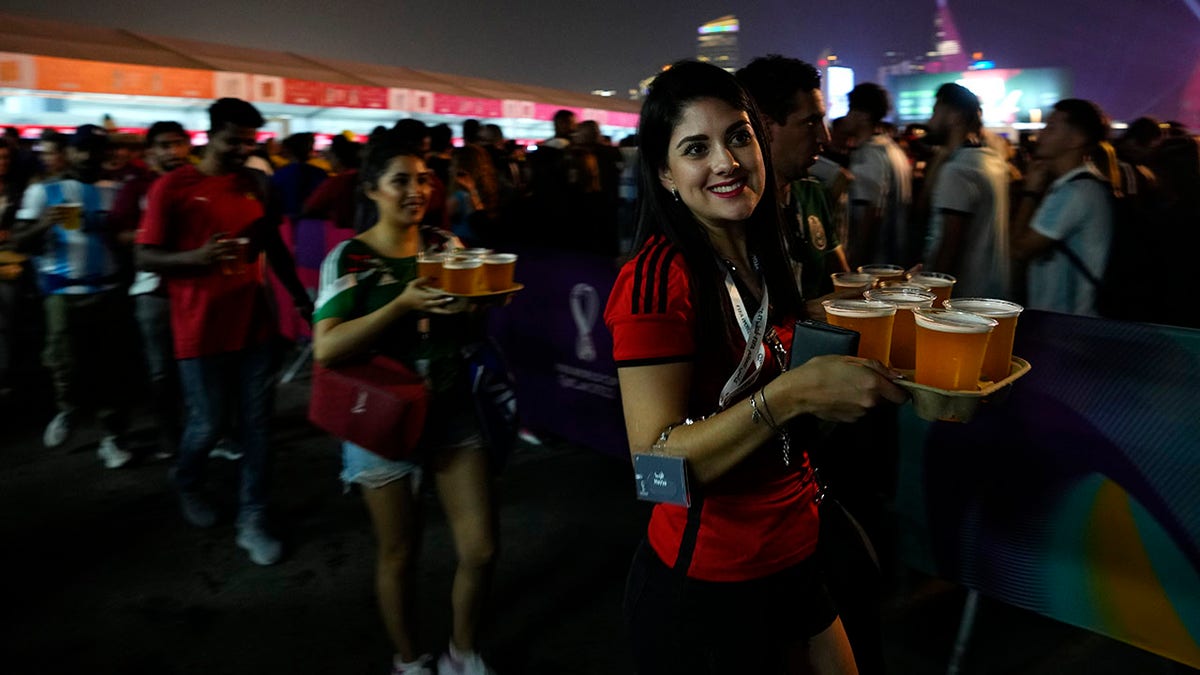 Fans carry beer