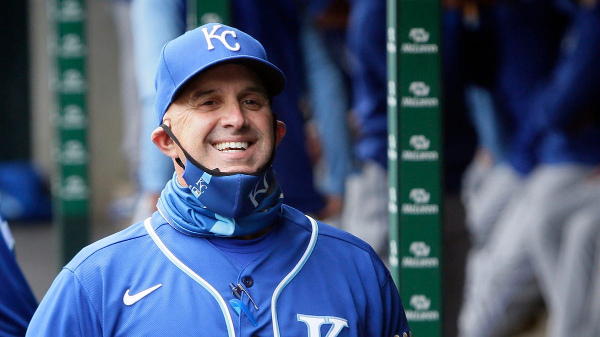 Pedro Grifol smiles in the dugout