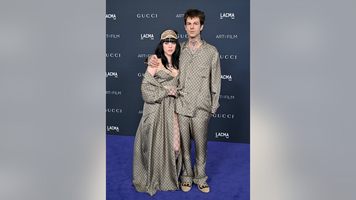 Billie Eilish and Jesse Rutheford in luxe Gucci print ensembles in LA