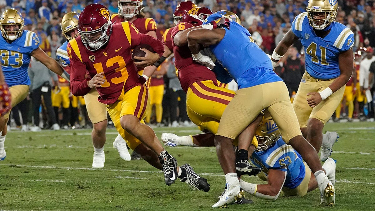 Caleb Williams runs for a TD