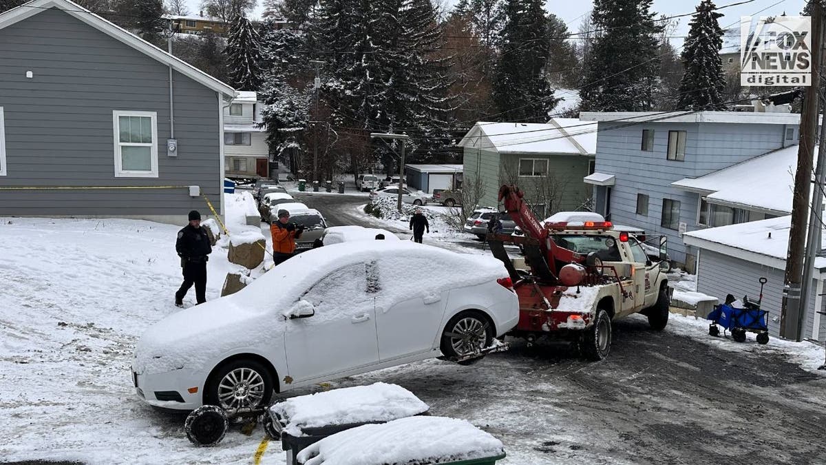 Cars of four slain college students towed to impound