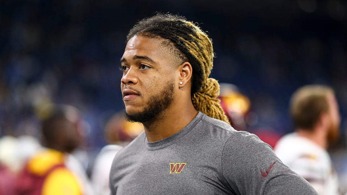 Chase Young looks on before an NFL game