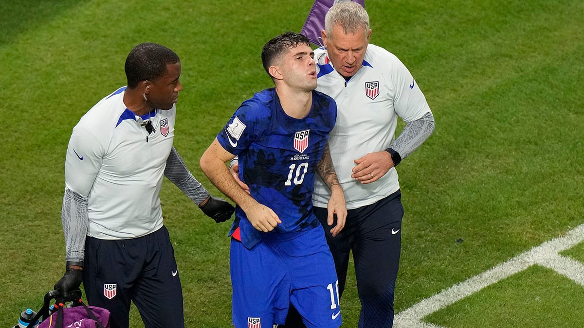 Christian Pulisic helped off the field