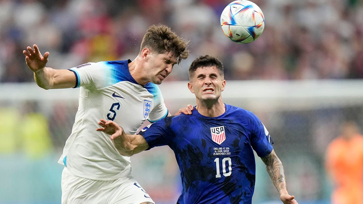Christian Pulisic challenges for the ball
