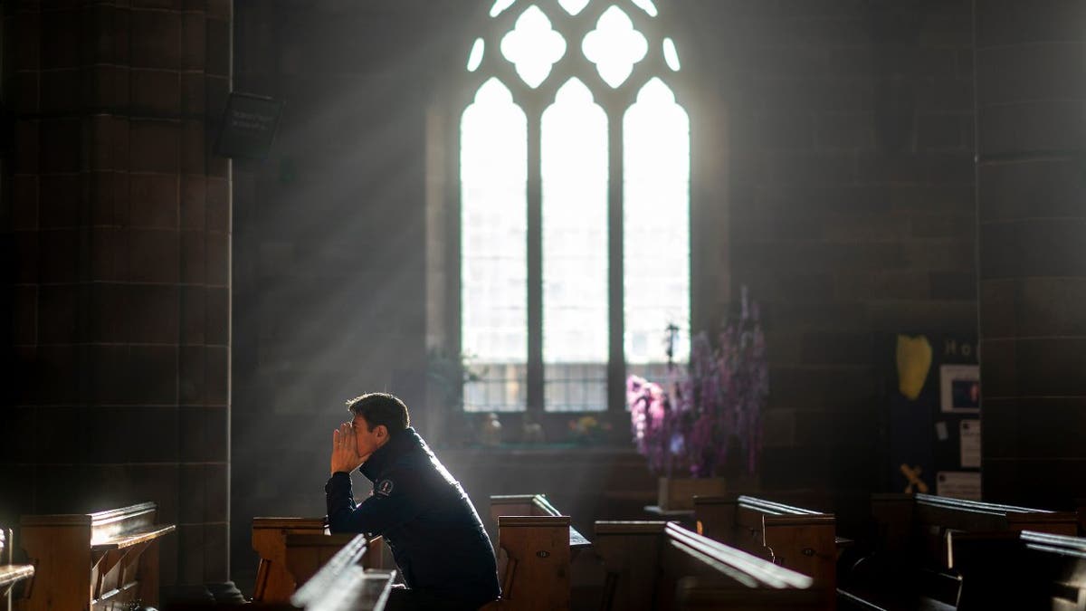 Man in church praying