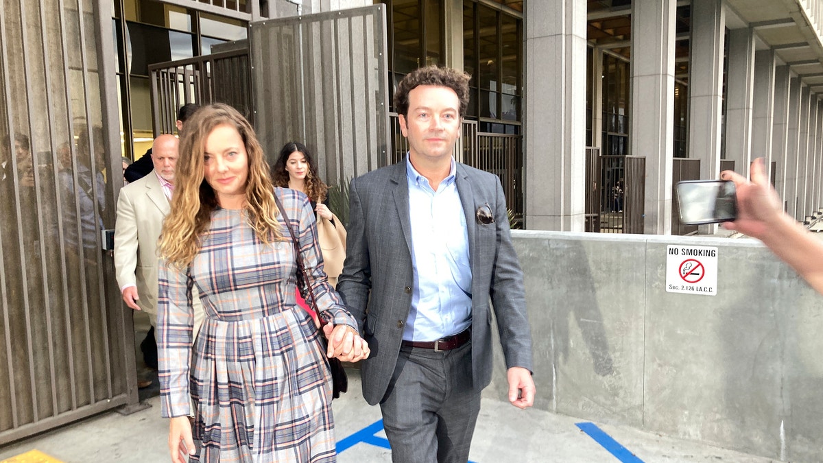 Danny Masterson and Bijou Phillips exiting the LA court