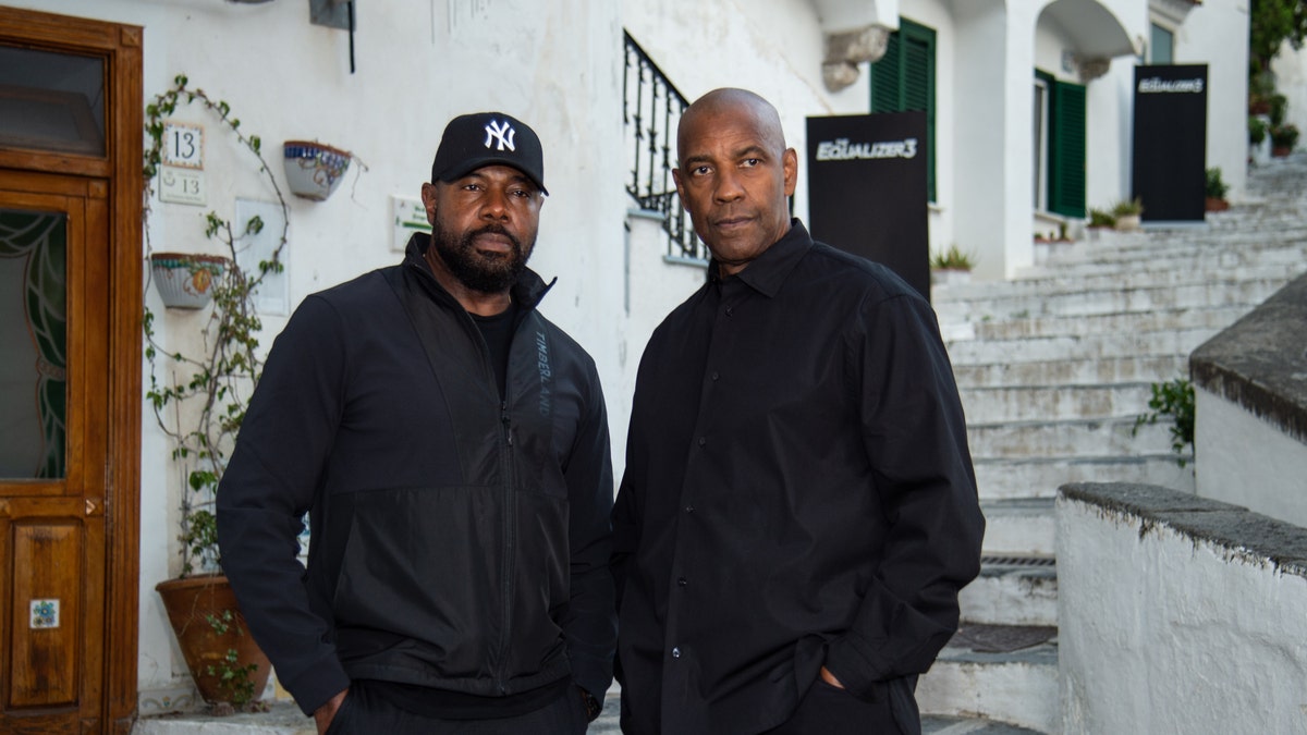 Denzel Washington and Antoine Fuqua wear all black in Amalfi Coast