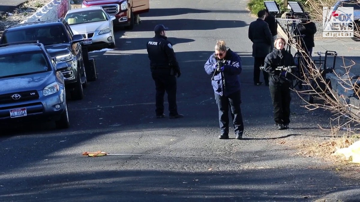 Tire marks being measured by forensics