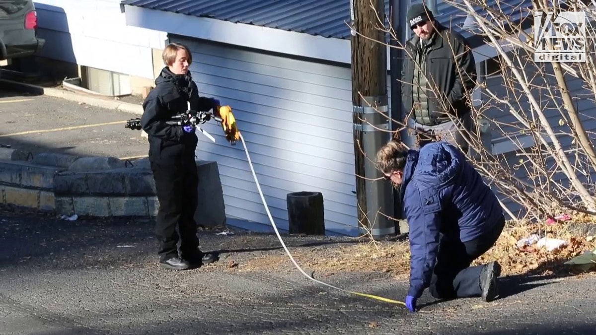 Tire marks being measured by forensics