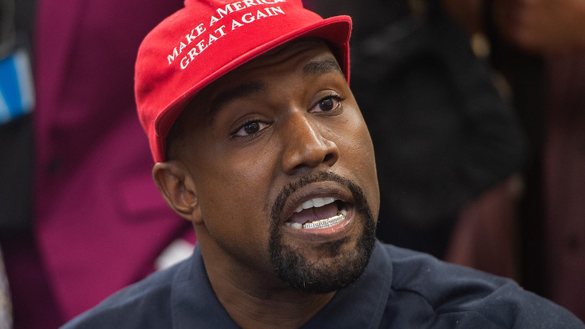 A photo of Ye wearing a MAGA cap