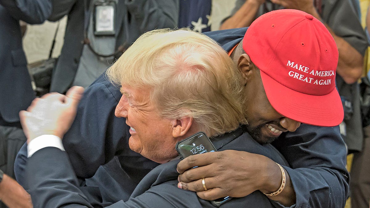 Kanye hugs Trump at White House