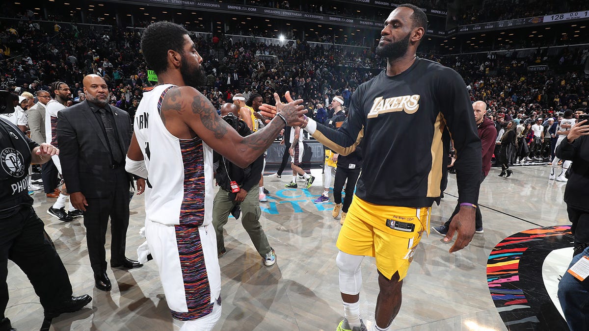 Kyrie Irving and LeBron James shake hands