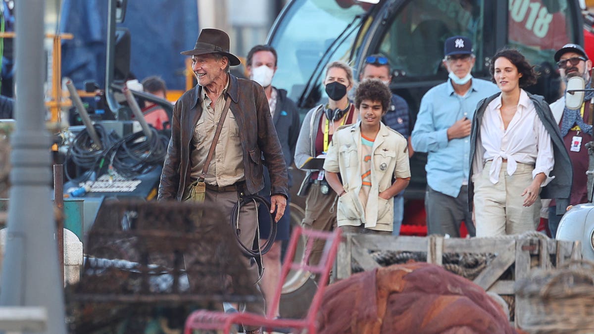 Harrison Ford and Phoebe Waller-Bridge film in Italy for "Indiana Jones 5" with several extras in the background