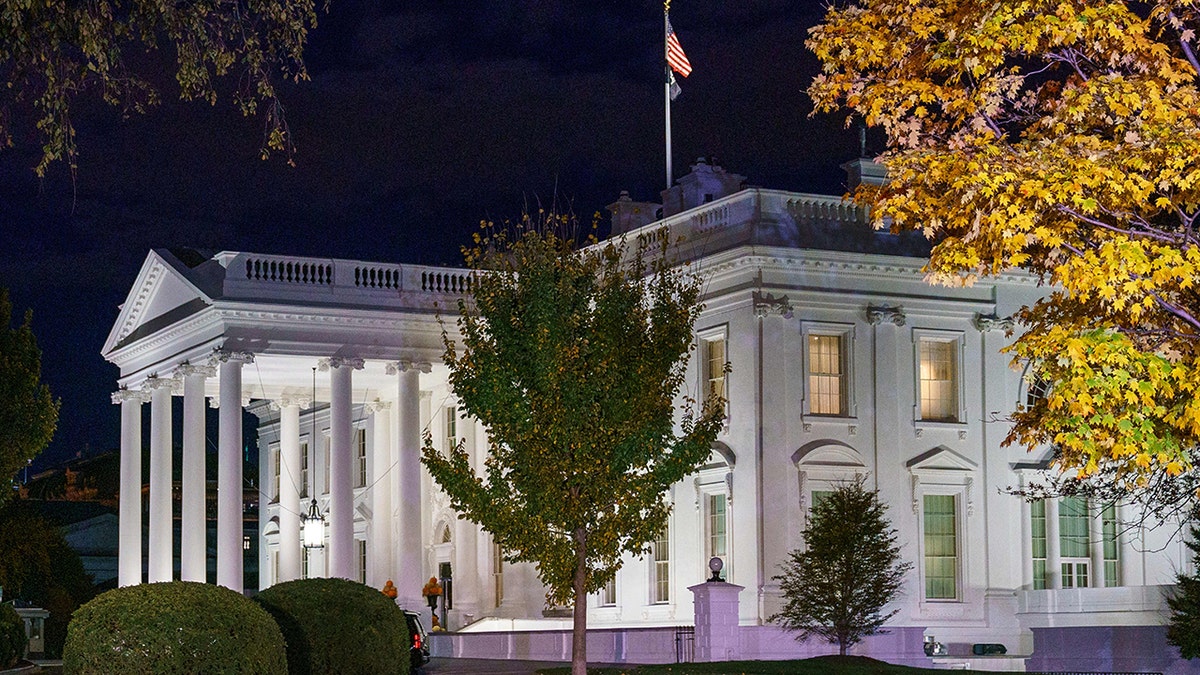 A photo of the White House at night