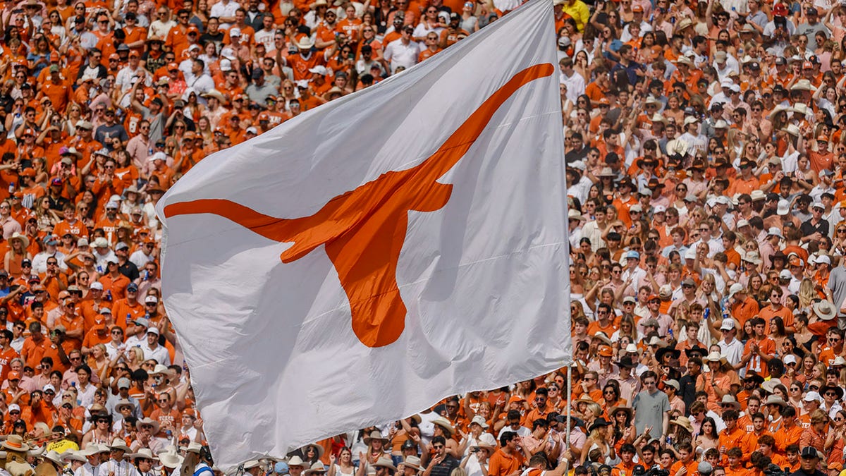 A Texas Longhorns flag is flown before a game