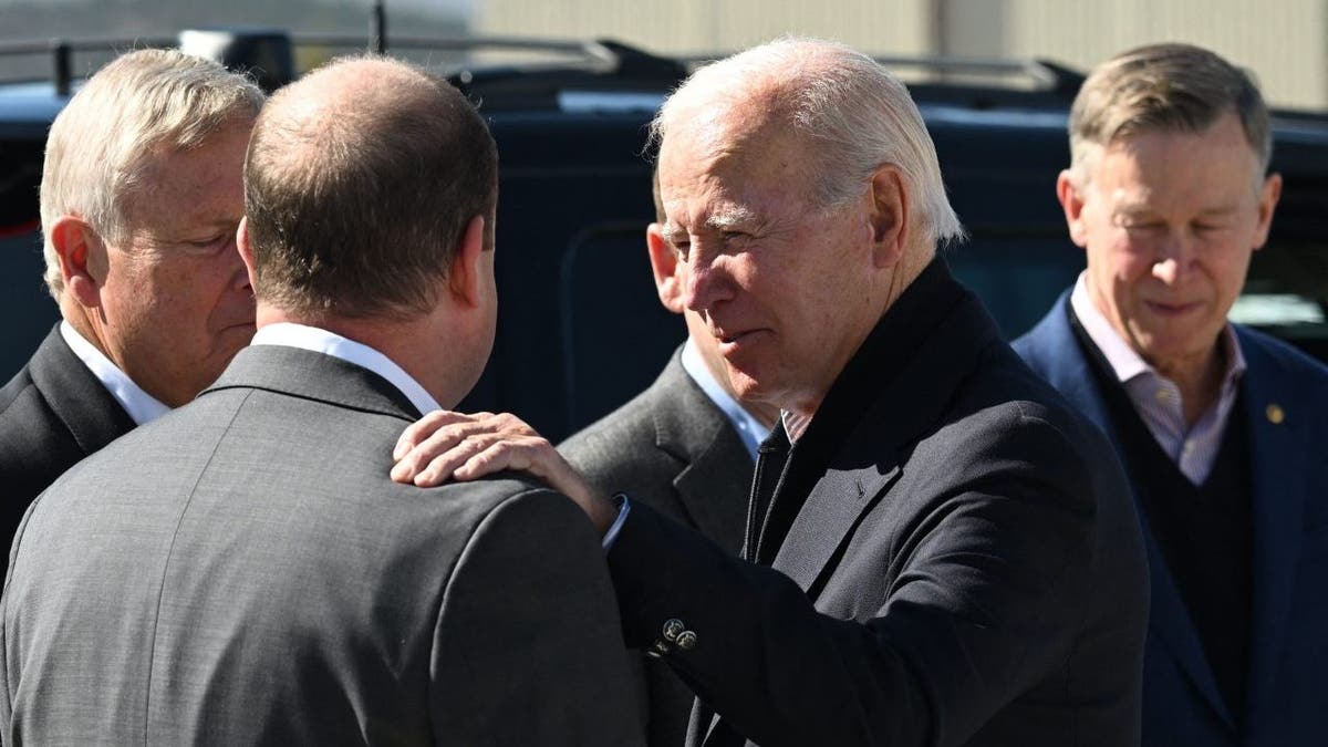 US President Joe Biden speaks to Colorado Governor Jared Polis