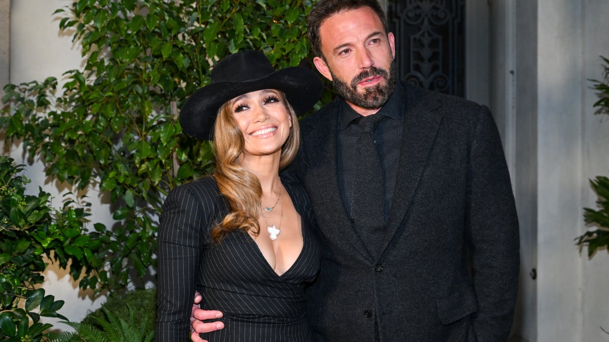 Jennifer Lopez and Ben Affleck pose in an all-black outfits for the Ralph Lauren Spring 2023 runway show