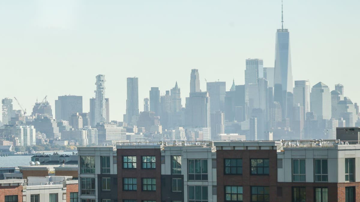 Jersey City in foreground with manhatten skyline in the background