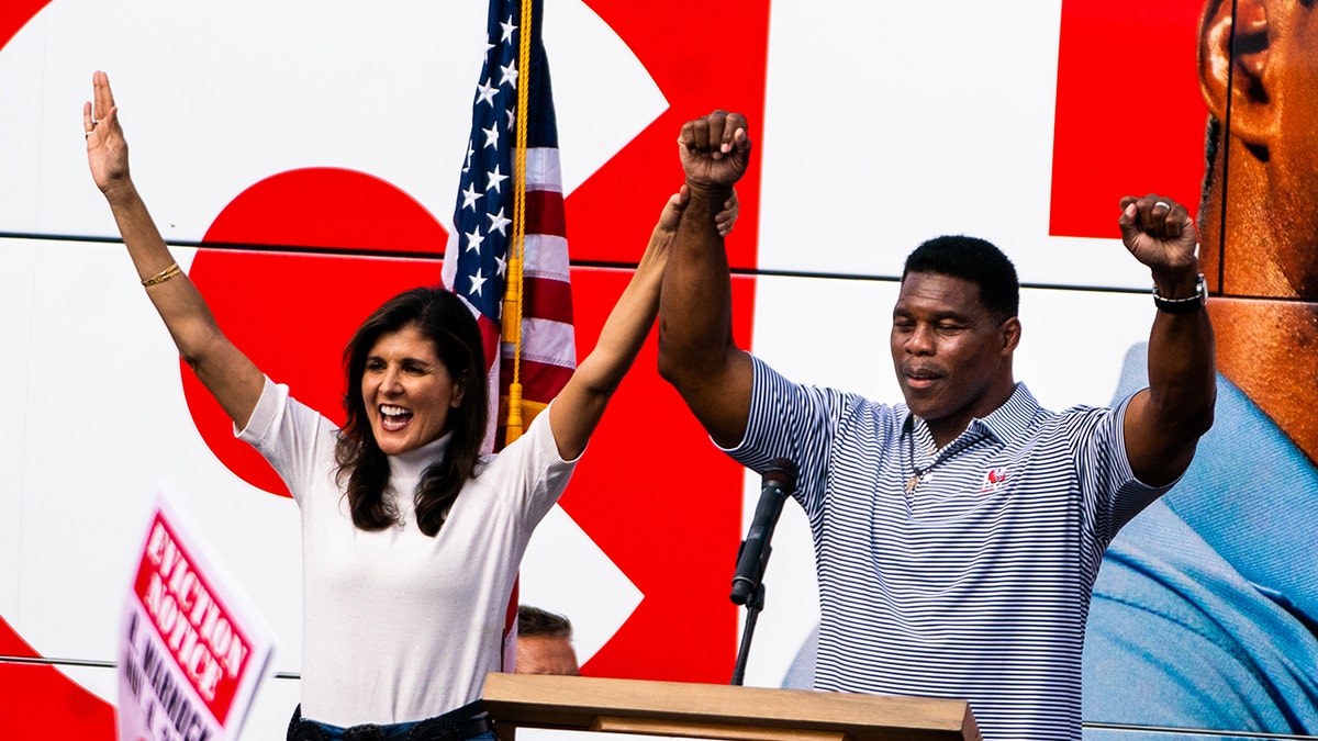 Nikki Haley joins hands with Walker at campaign rally