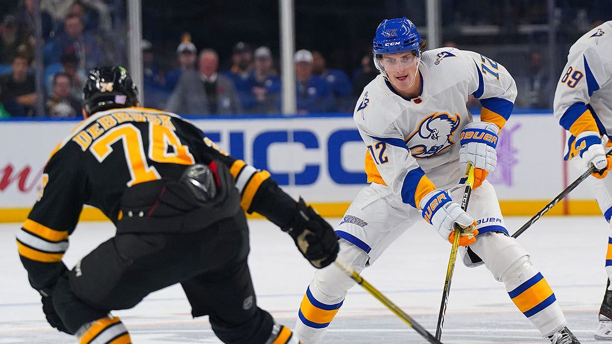 Tage Thompson skates with the puck vs. the Bruins