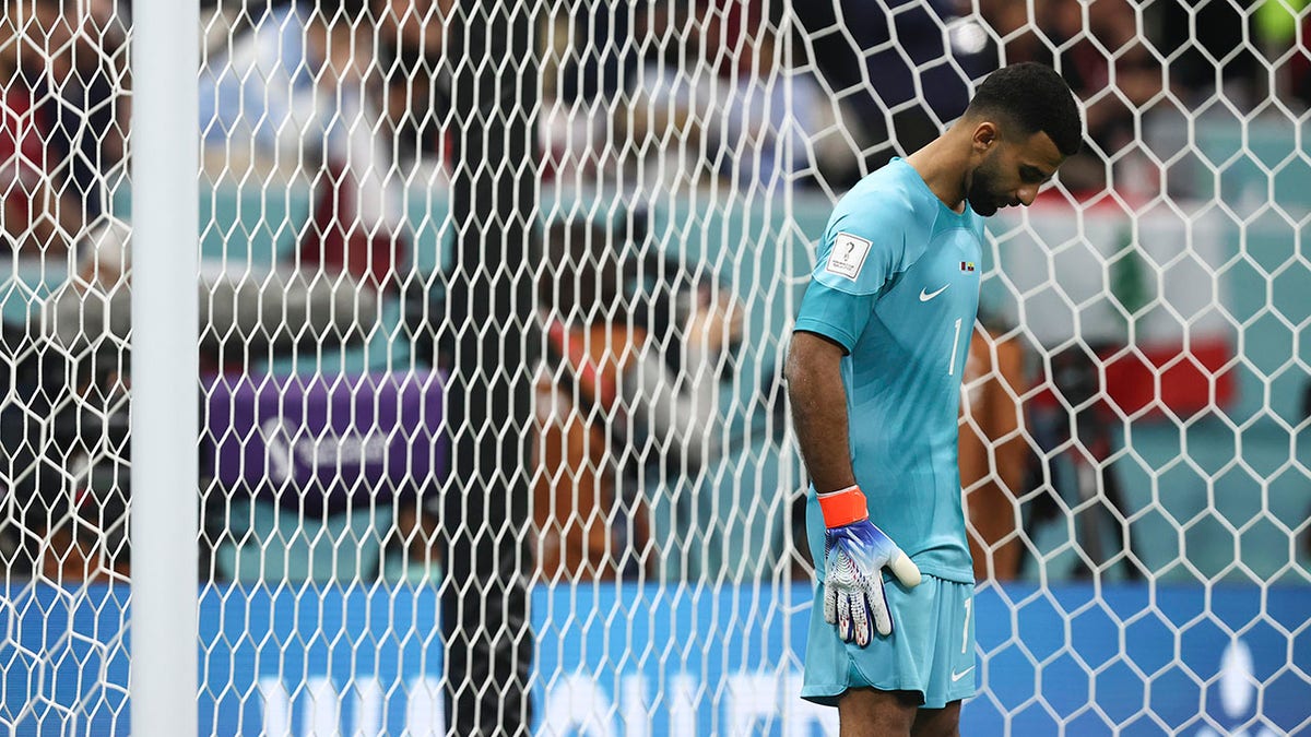 Qatar's Saad Al-Sheeb reacts to a goal by Ecuador