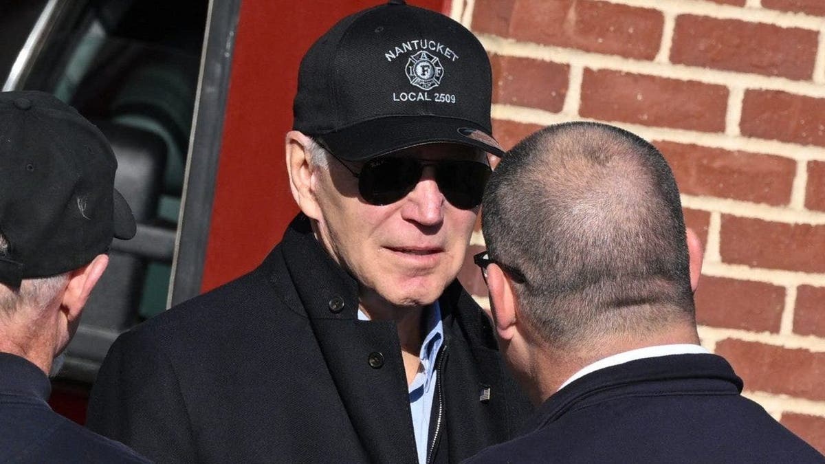 President Biden speaks with firefighters as he visits a Nantucket, Massachusetts, fire station to thank first responders during the Thanksgiving Day holiday, on Nov. 24, 2022.