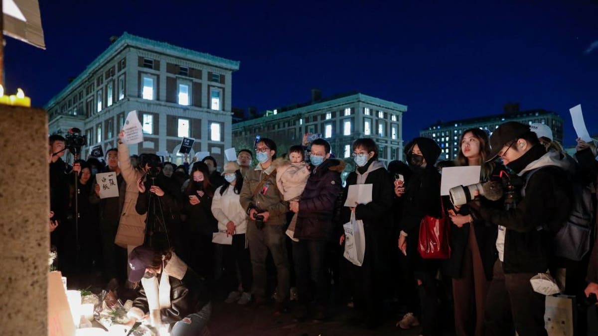 Protesters at Columbia University light candles