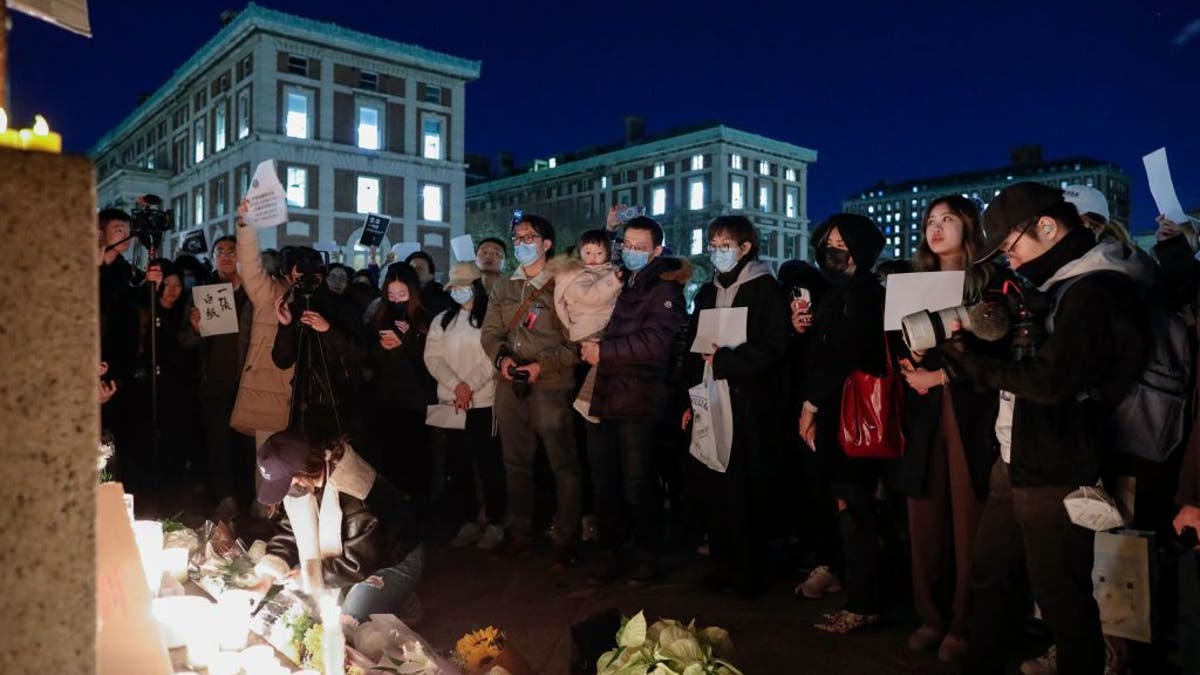 Protesters at Columbia University light candles