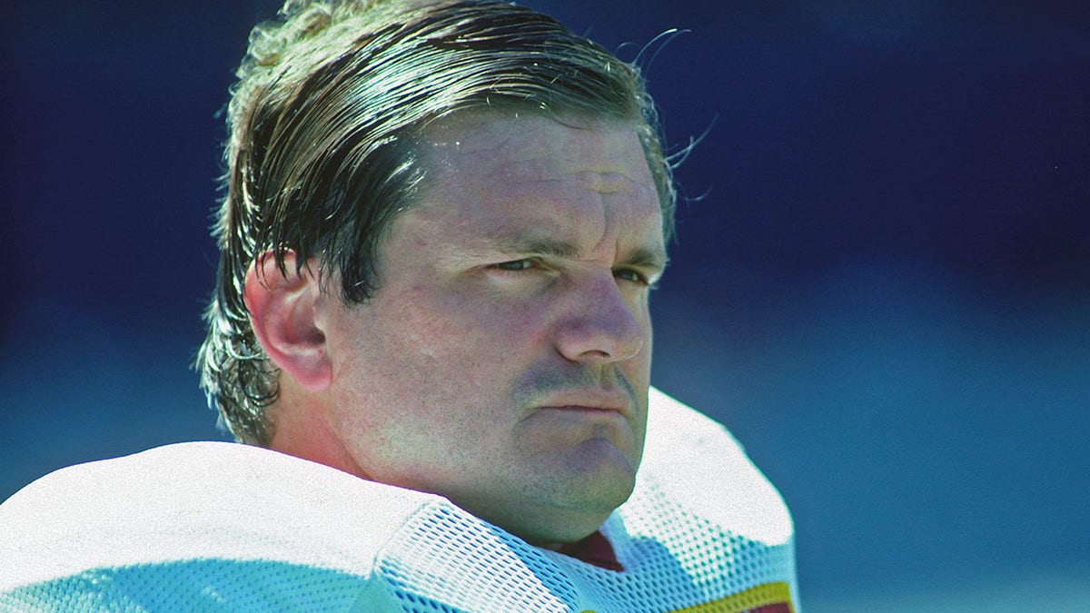 Dave Butz stands on the sideline during a game against the Oilers