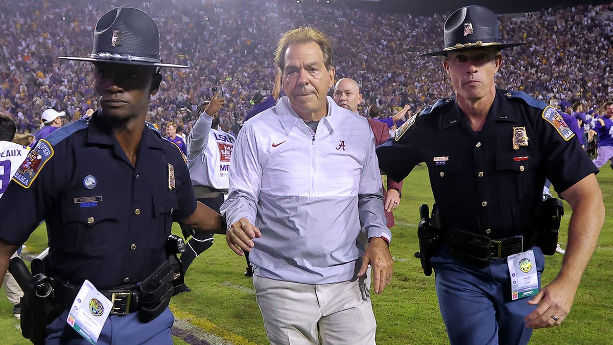 Nick Saban walks off the field following the loss to LSU