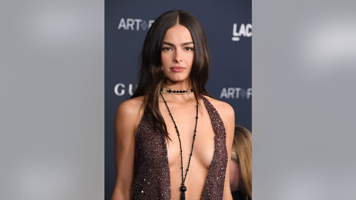Addison Rae bared her cleavage in a low-cut brown sparkly number