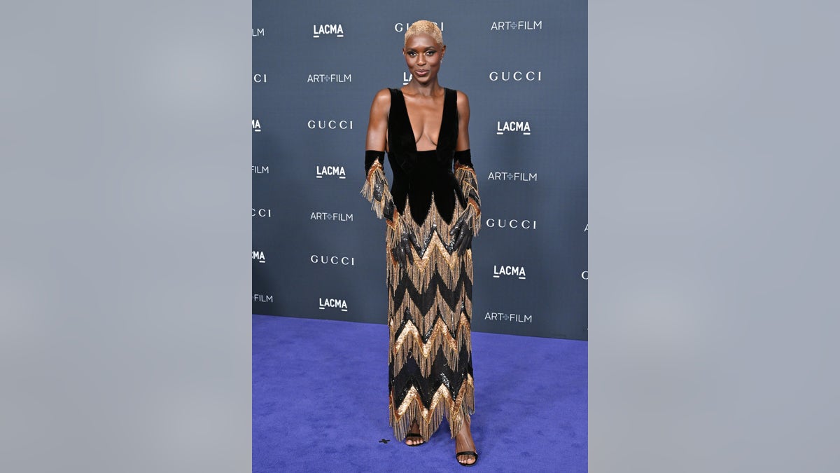 Jodie Turner wore a low cut Gucci number with a chevron bottom