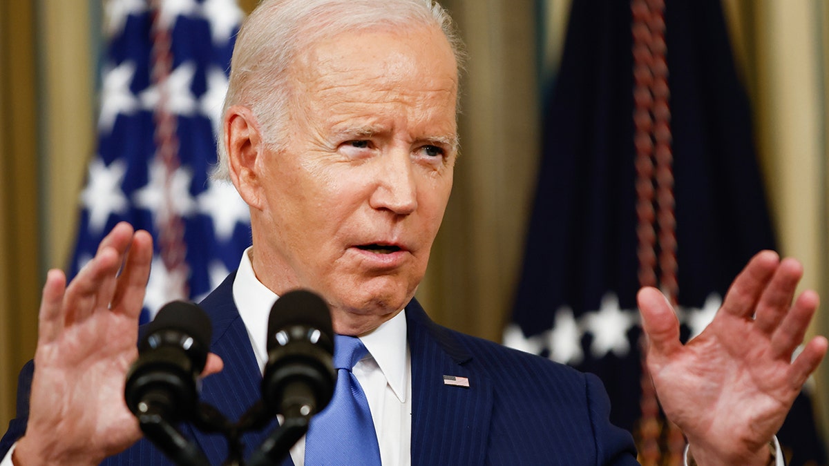 President Biden with his hands up