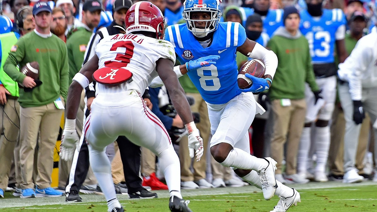 Malik Heath carries the football