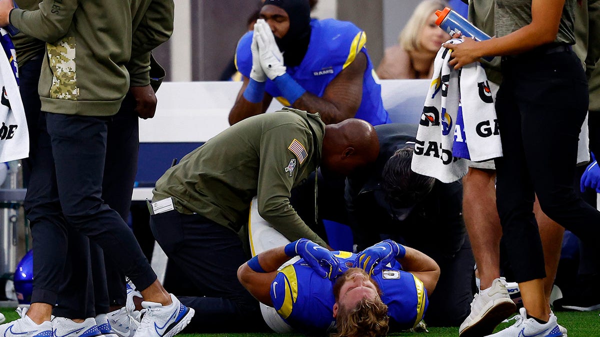 Cooper Kupp lays on the ground after injuring his ankle