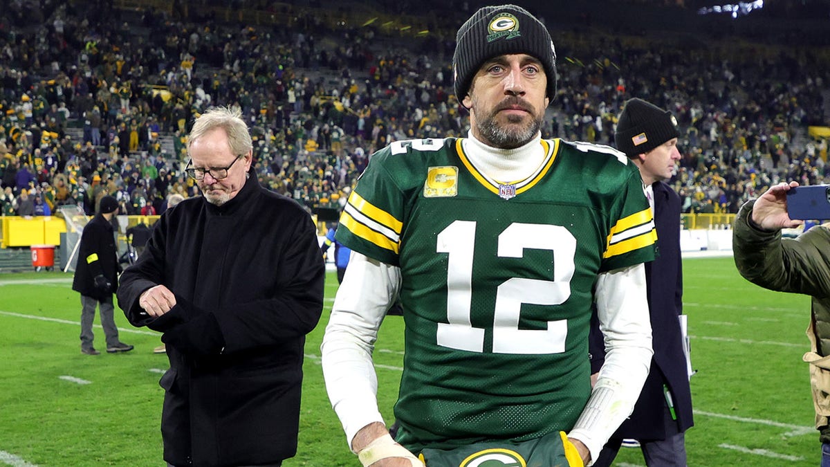 Aaron Rodgers walks off the field after beating the Cowboys