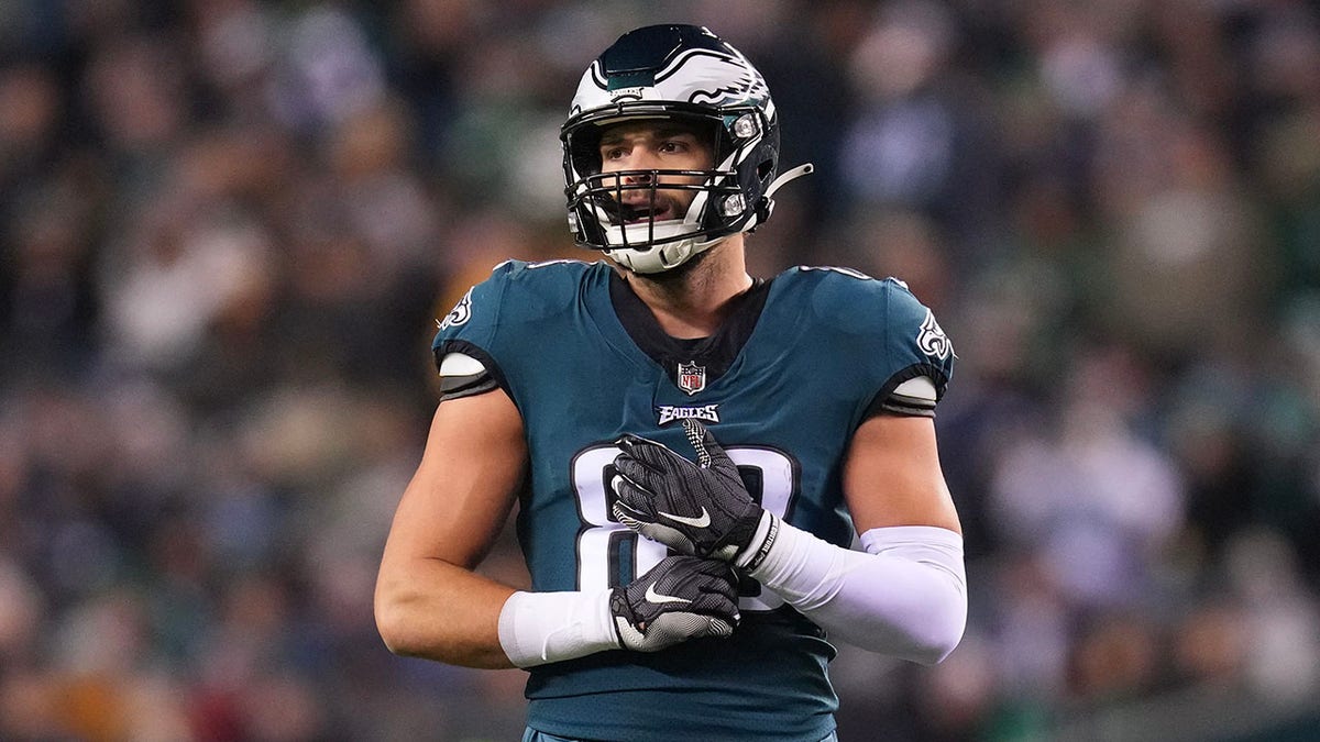 Dallas Goedert stands on the field vs the Commanders
