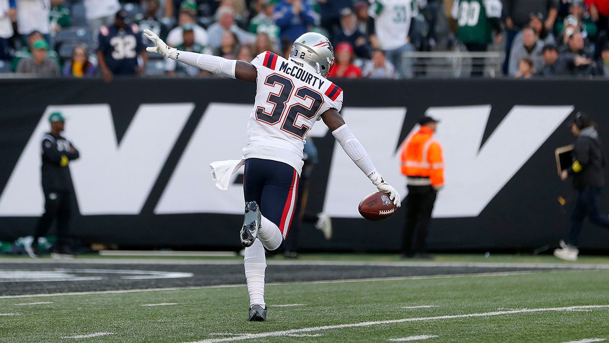 Devin McCourty celebrates an interception