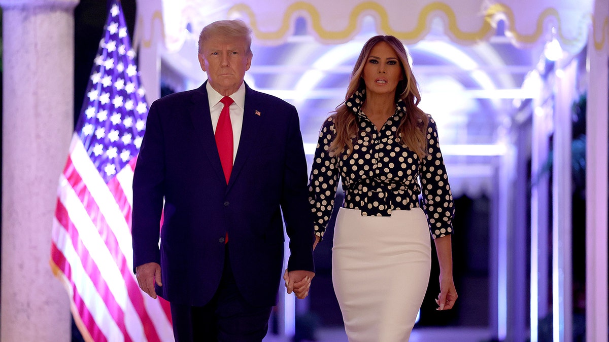 Donald Trump holding Melania's hand