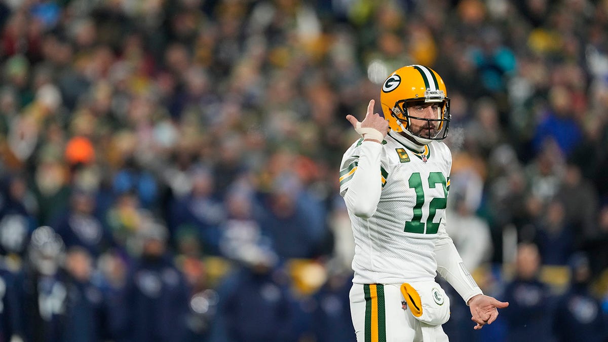 Aaron Rodgers reacts to a play against the Titans